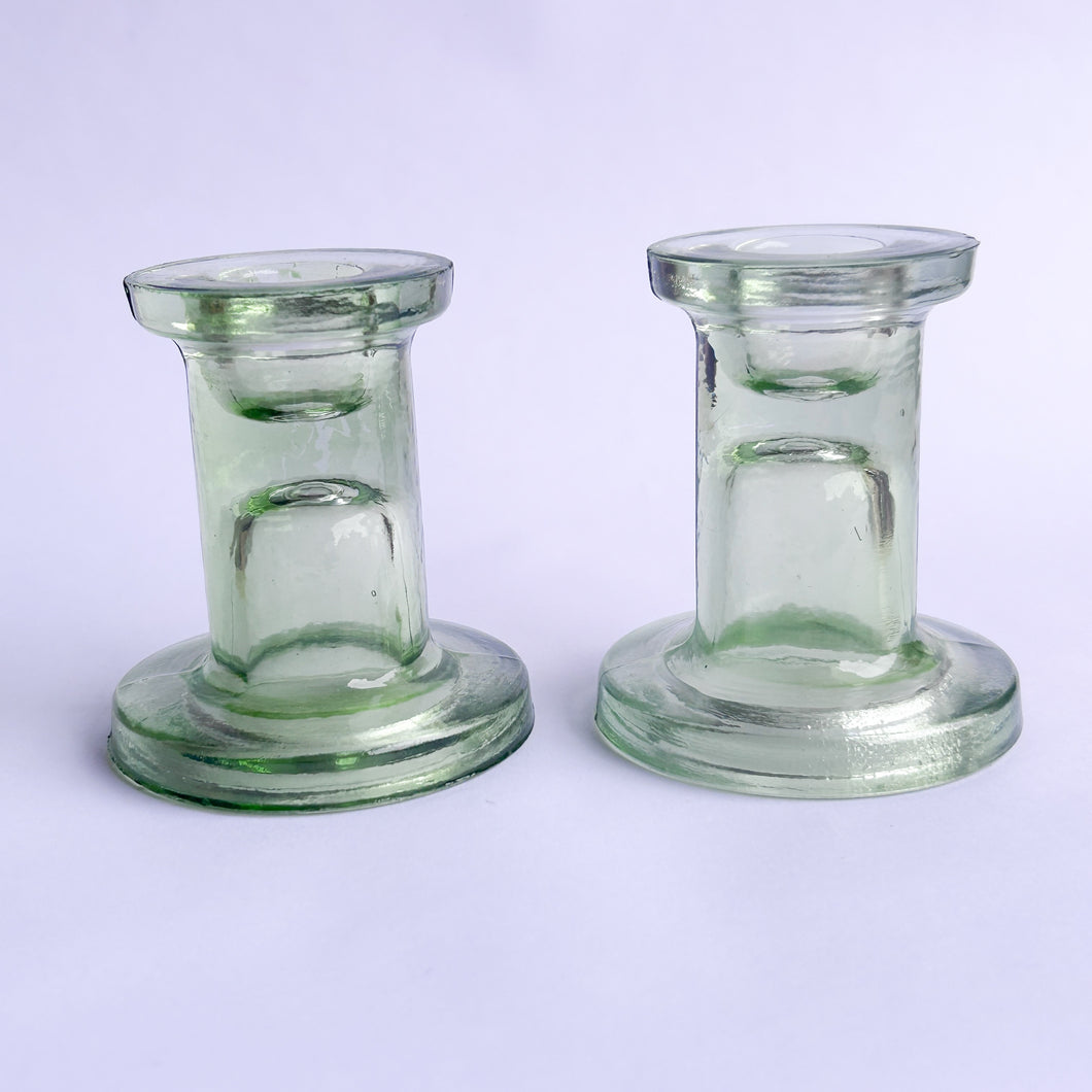 Pair of green glass candlesticks