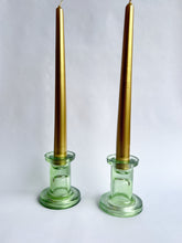 Pair of green glass candlesticks